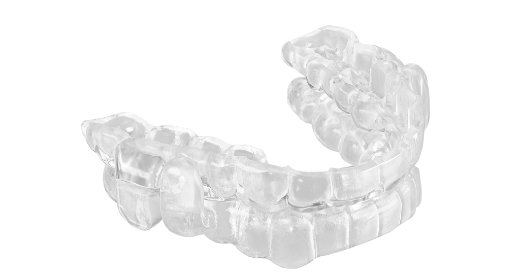 A close up of an individual 's teeth in braces